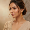 Radiant Multi-Tiered Filigree Gold Jhumka Earrings