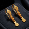 Elegant Textured Gold Drop Earrings with Cascading Discs